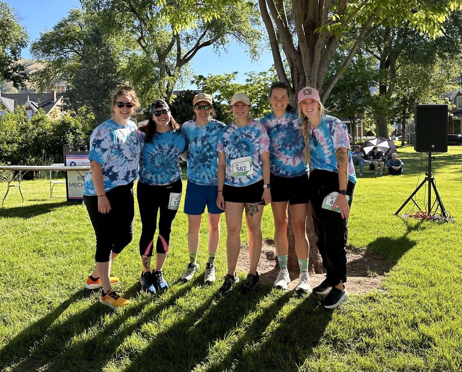A group of employees in tie-dye.