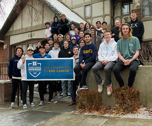 Beta Epsilon with Generation to End Cancer banner outside fraternity house