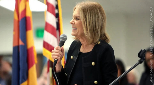 Gloria Steinem holding microphone