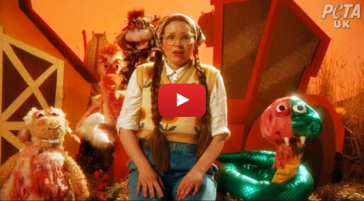Actor Jessie Cave looking horrified next to bloody animal puppets
