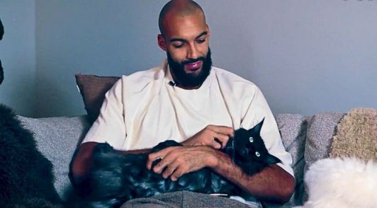 Rudy Gobert holding his cat