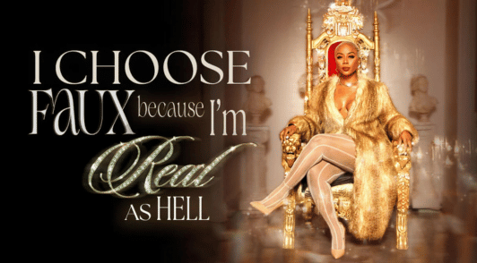 Pinky Cole wearing faux fur with the words I choose faux becuase Im real as hell