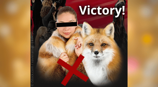 woman wearing fur coat next to image of a fox and the word victory
