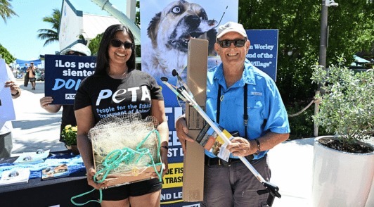 man receiving a trash fishing kit for his fishing gear