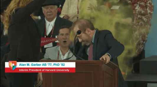 Harvard President getting glitter bombed