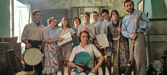 The Durrell family gathered together with musical instruments in hand.