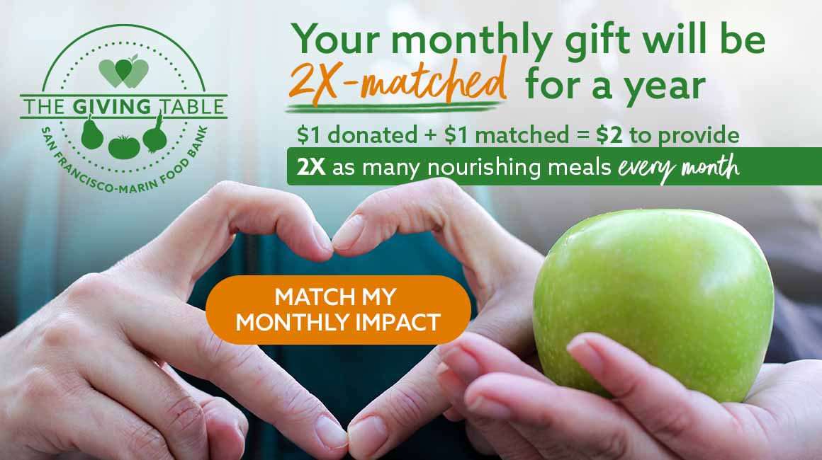 Hand in heart shape next to hand holding green apple