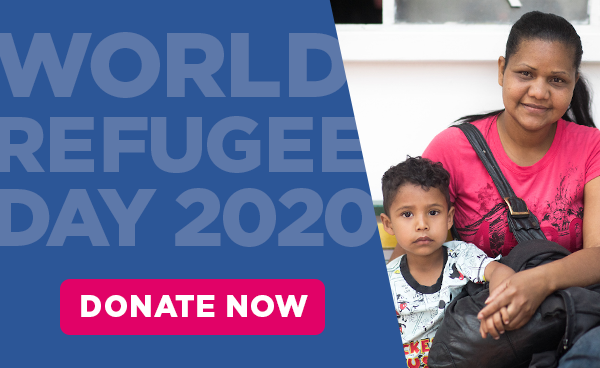 A mother sits with a young boy. Give now for World Refugee Day
