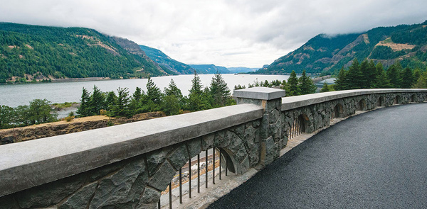 Road with water and mountains in the background