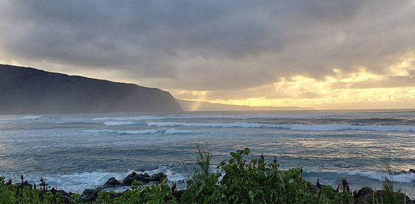 Ocean with mountains in background