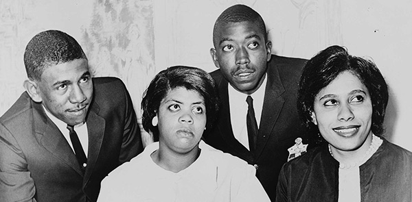 Black and white image of four people