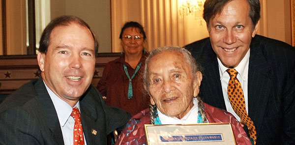 Four people smiling at camera