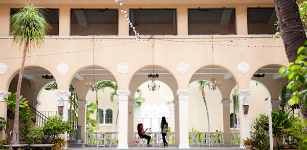 Lightly colored building with arches