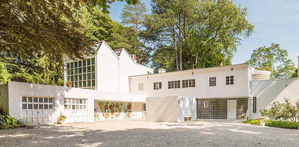 modern white house with many glass windows