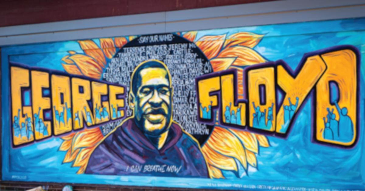 mural of George Floyd on a wall near the site of his murder