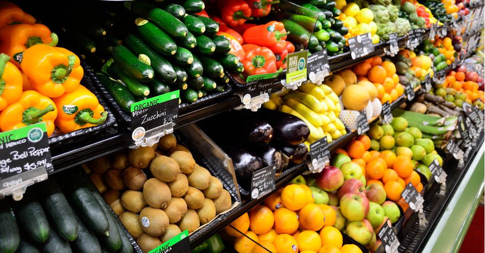 fresh produce for sale in a grocery store cooler