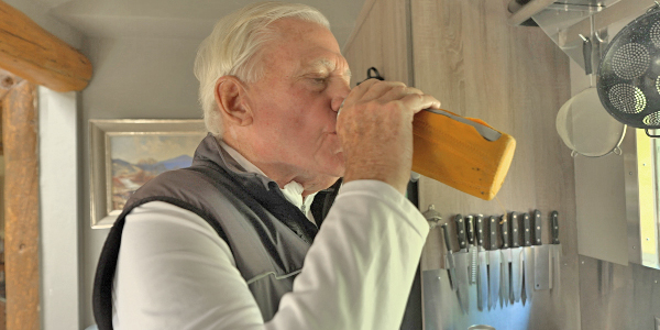 Older man drinking a bottle of water