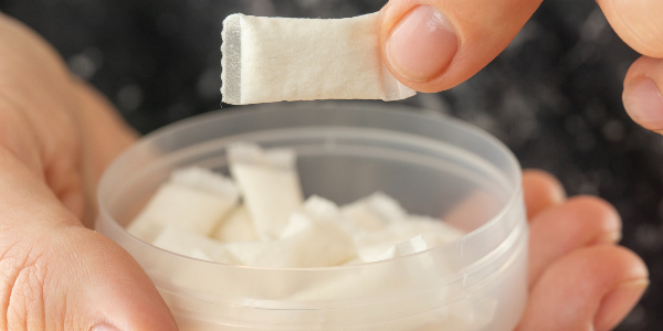 Nicotine pouches in an open container.