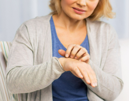 Woman scratching her hand