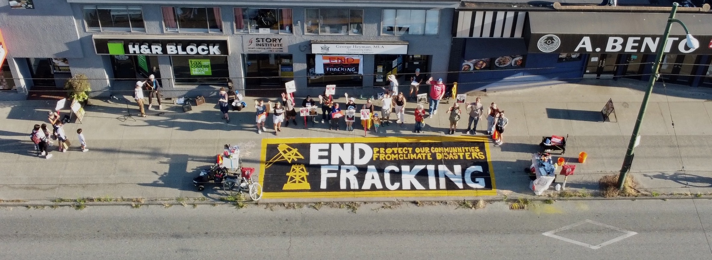 Protesters stand with a climate emergency banner on Montgomery street in San Francisco