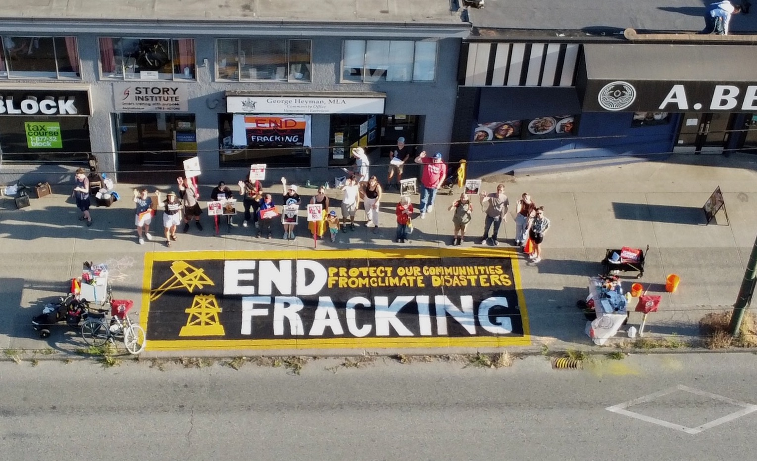 Aerial drone photo of an end fracking banner outside george heyman's office