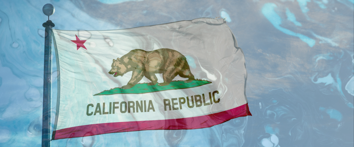 California flag against an oil spill background