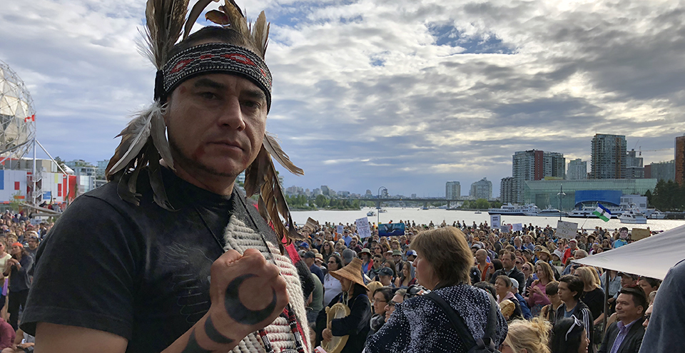 Tsleil-Waututh leader Will George stands at a Trans Mountain rally in Vancouver