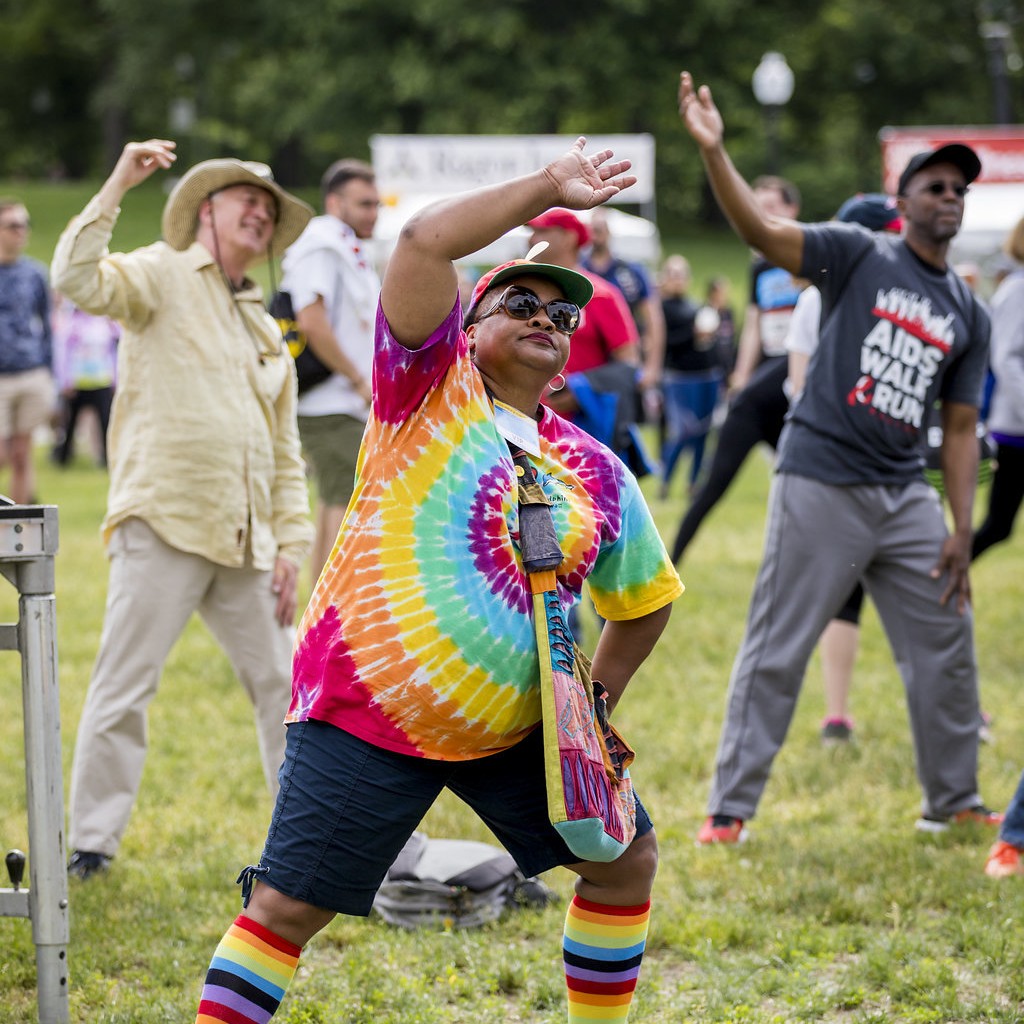 A group of people stretching before they Stride