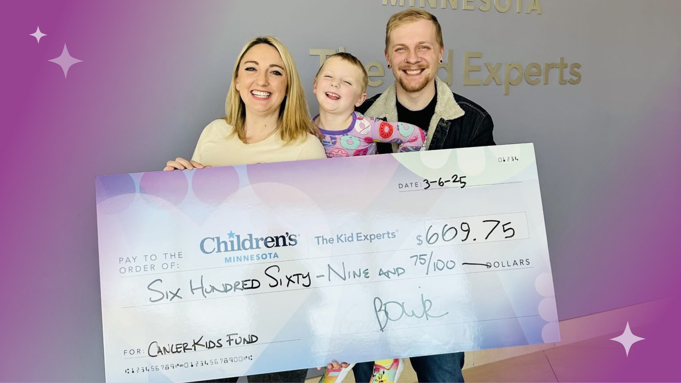 family with fundraising check