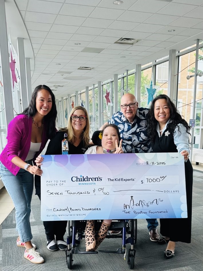 family with fundraising check