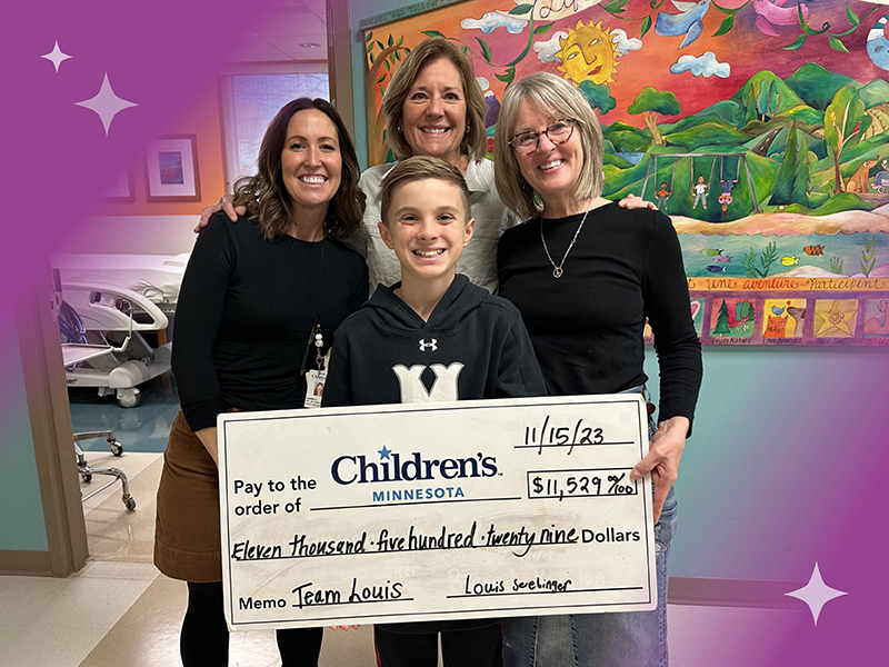 family with fundraising check