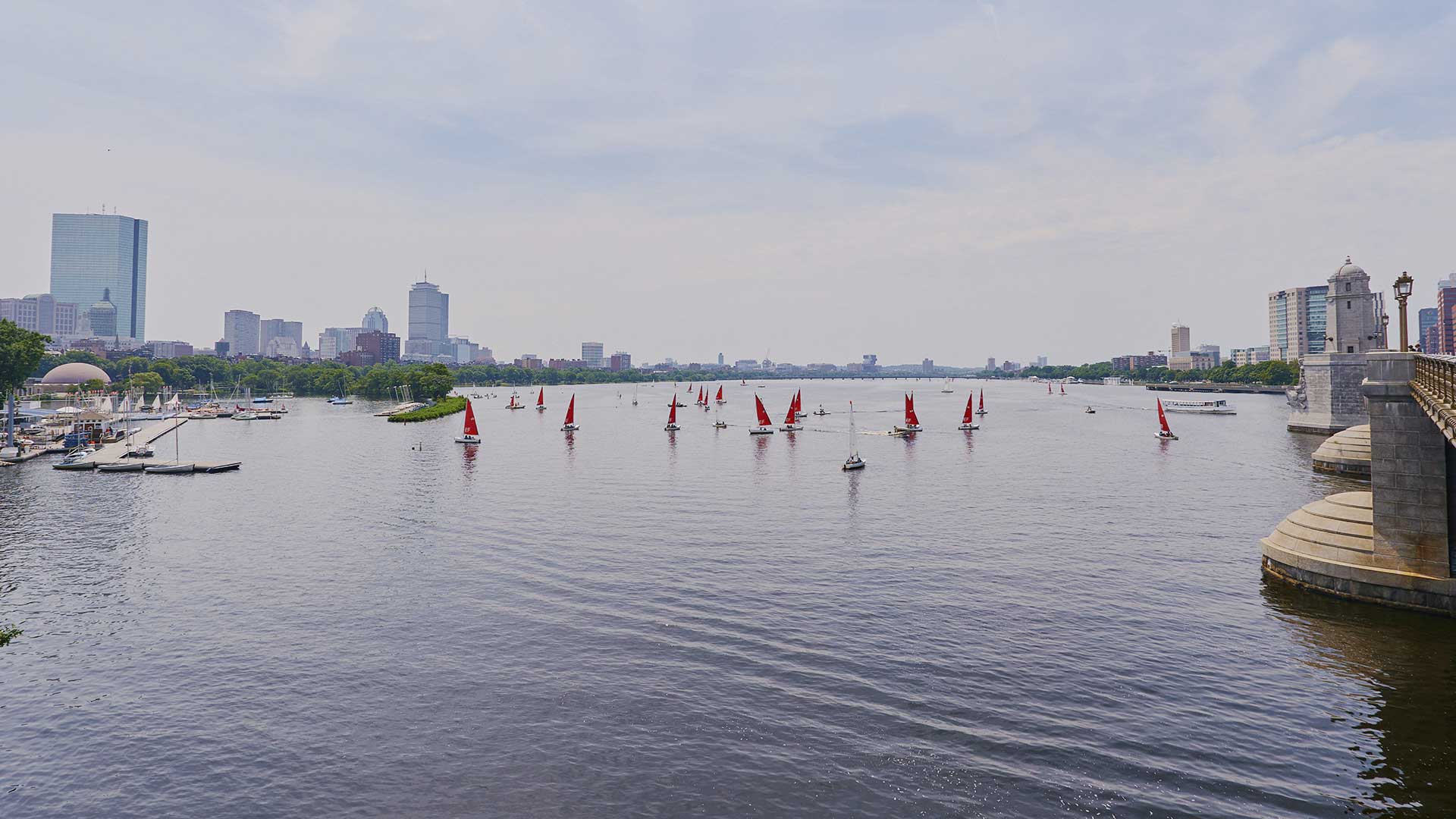 Boaters on the Charles River. Longfellow Bridge and part of the Boston skyline is visible