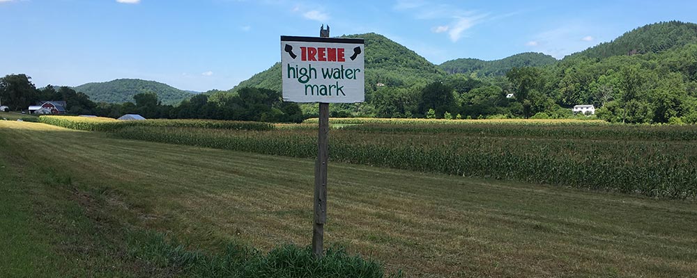Field in Vermont, with sign saying "Irene high water mark"