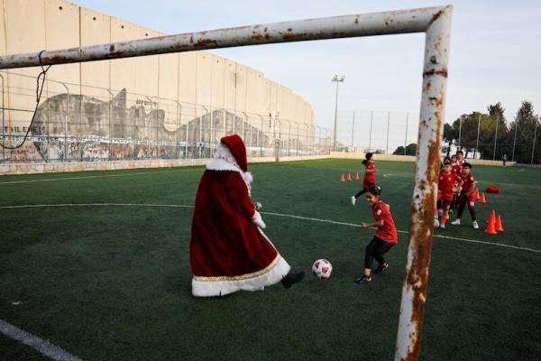 Santa playing soccer in Palestine