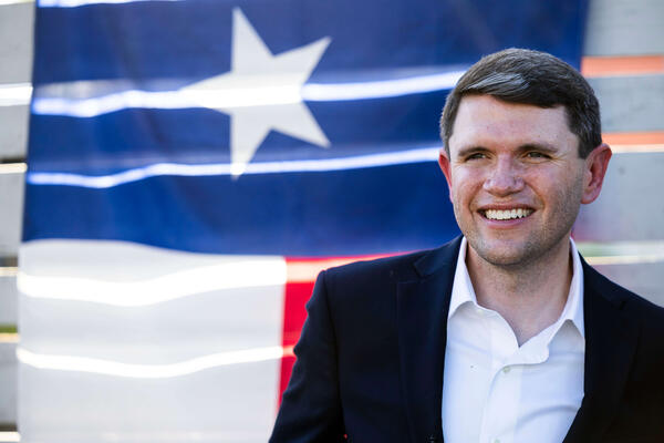 James Talarico in front of the Texas state flag