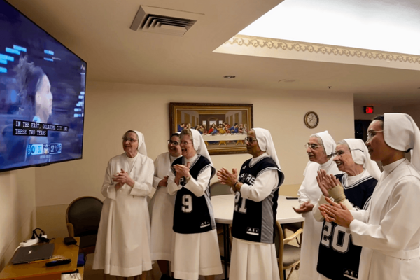 The Salesian Sisters of St. John Bosco in San Antonio root for the San Antonio Spurs during Game 5 of Western Conference Semifinals