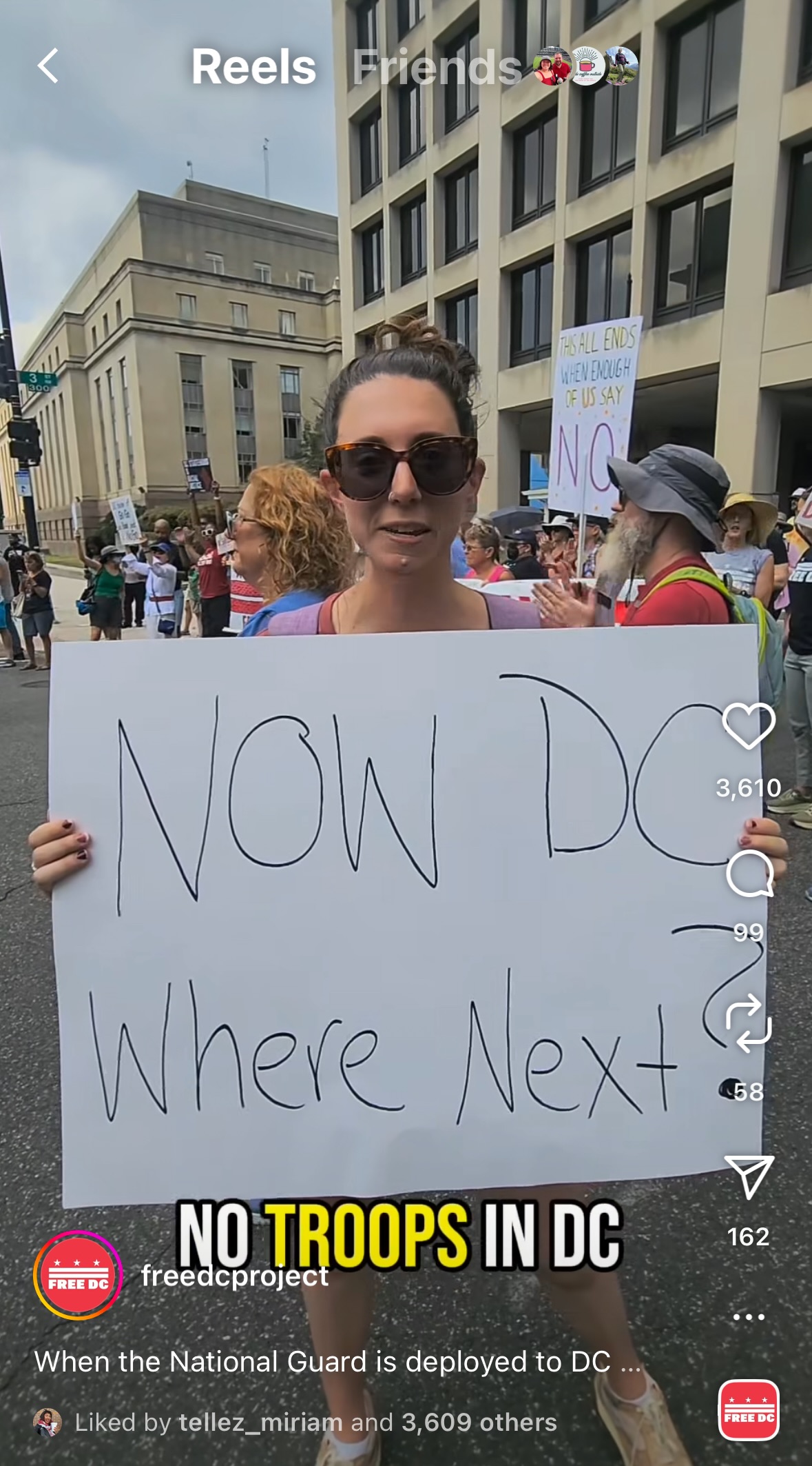 A Protestor holding a sign against the occupation of DC