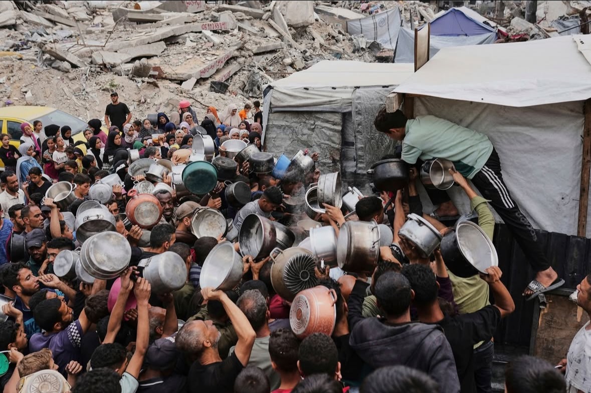 Palestinians waiting in line for food distribution