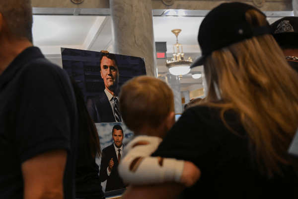 A photo of Charlie Kirk in stands displayed in the Utah State Capitol building