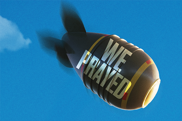A bomb labeled 'WE PRAYED' hurtles through the air