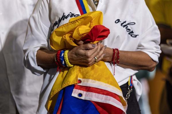 Woman holds Venezuelan flag