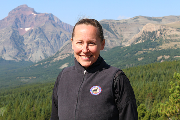 Erin Edge - Headshot with scenic mountain background © Leigh Anne Tiffany/DOW