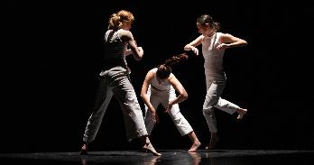 Three performing arts students doing an interpretive dance