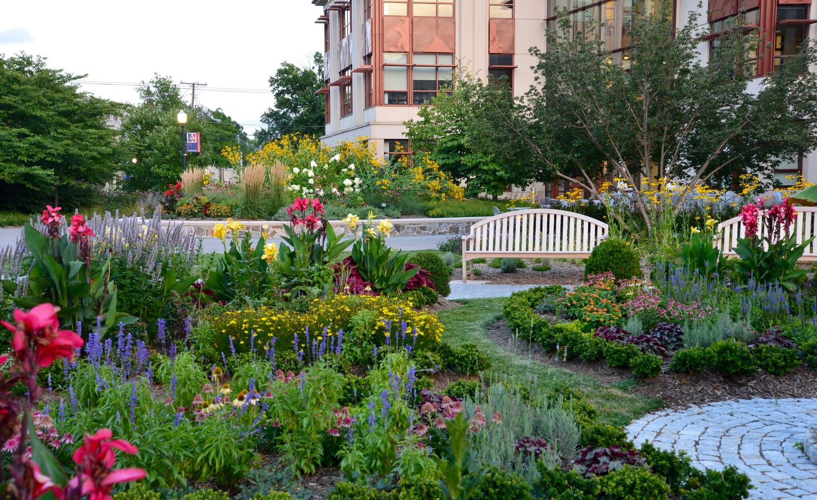 Sitting area outside of Bender library with flowers