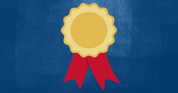 Gold medal with red ribbon against a blue background.