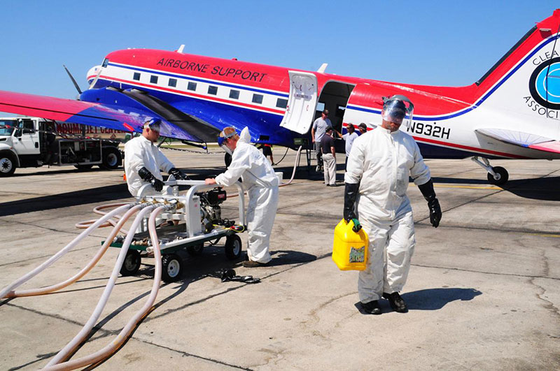 photo of an aircraft being loaded with chemicals