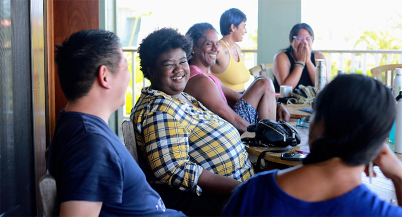 photo of people laughing together