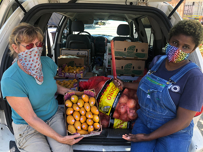 photo of masked food delivery people