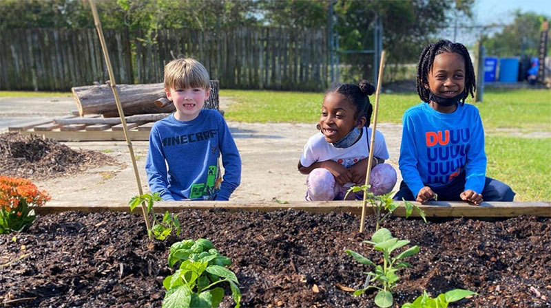 photo of children gardening