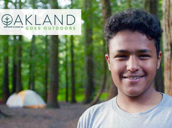 photo of a young person near a tent